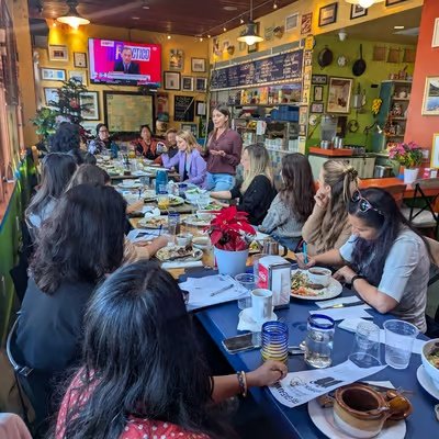 Women founders gathered around a long table at a FoundHER and FundHER event
